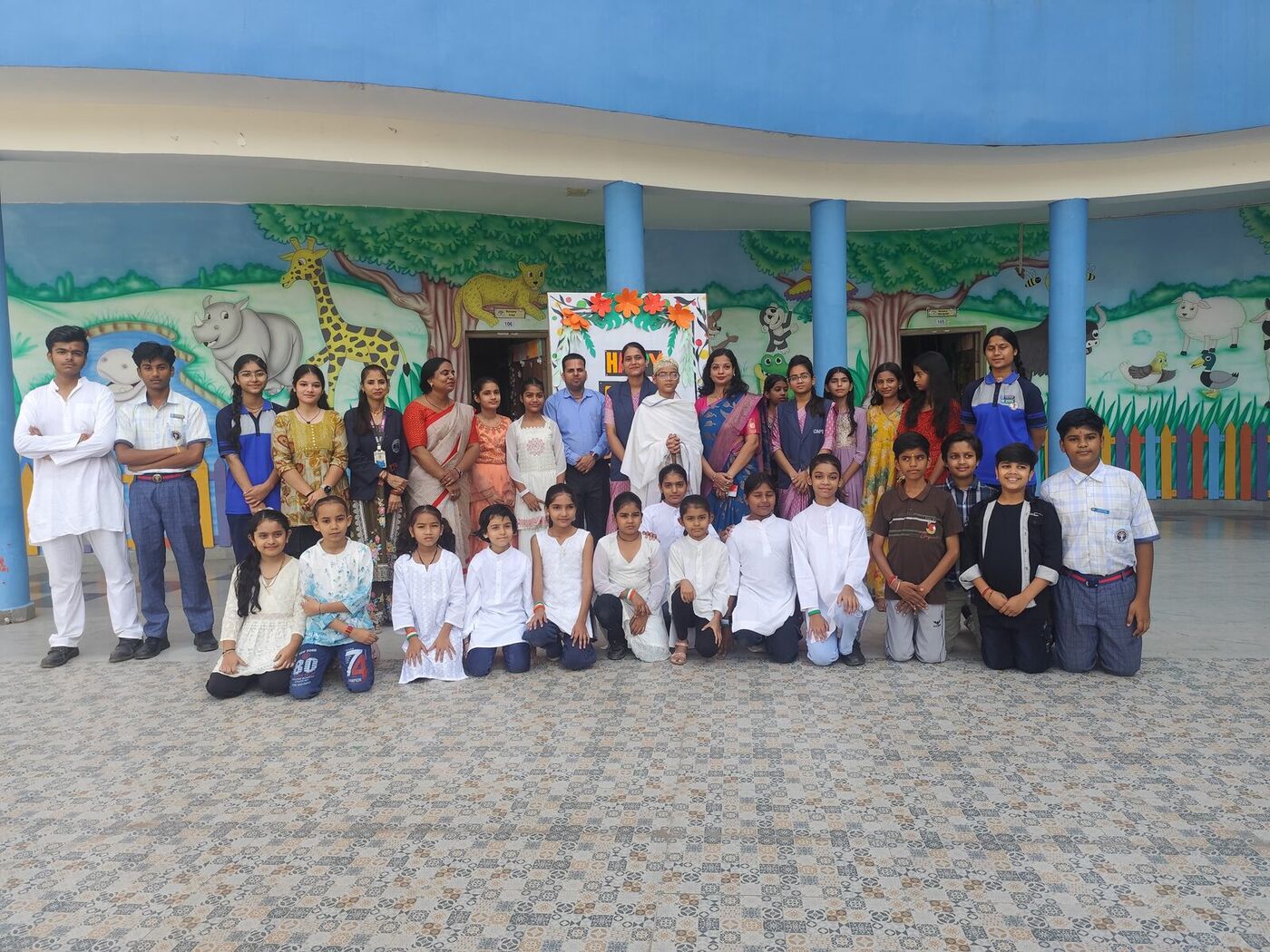 Students and teachers gather in the school courtyard on Gandhi Jayanti