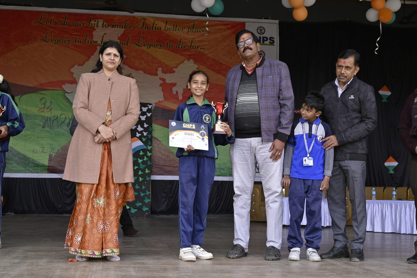 Students receive prizes from guests on Republic Day 2026