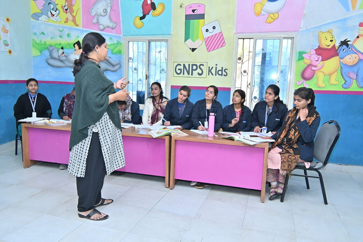 A resource person leads a teacher training session at GNPS