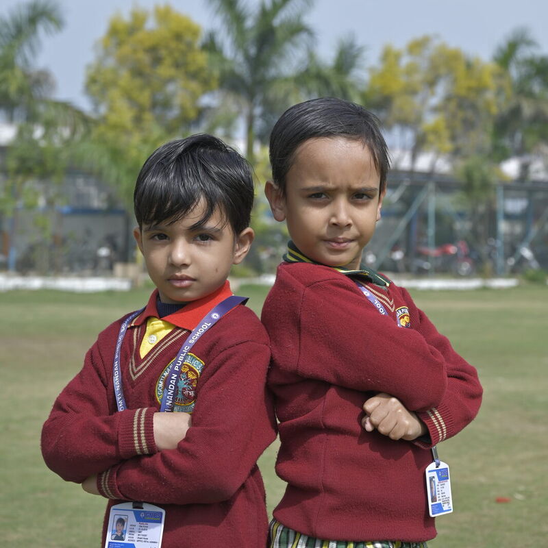 Two young boys in GNPS winter uniform